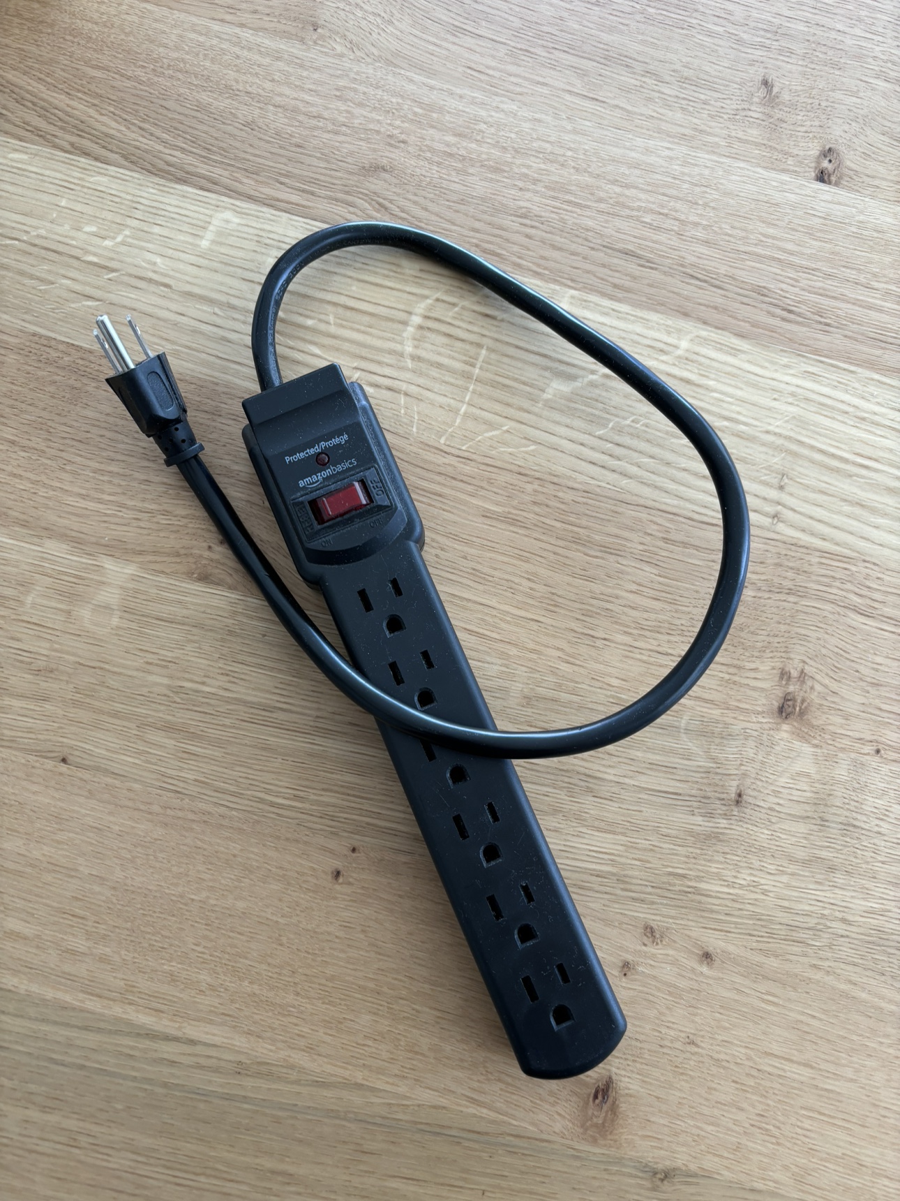 Outlet extension with surge protection
