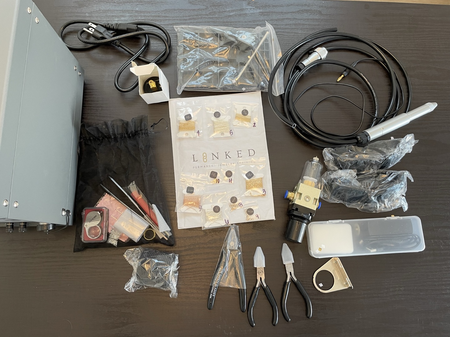 Permanent jewelry starter kit with over 20ft of chain