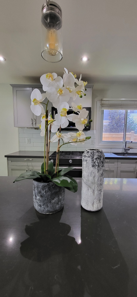 faux orchid and decorative vase