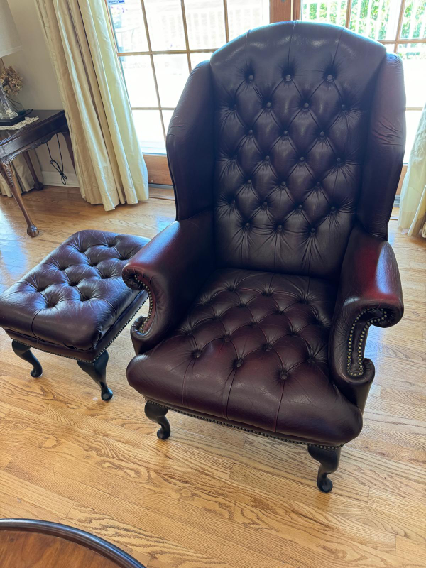 Burgundy Chesterfield arm chair and ottoman