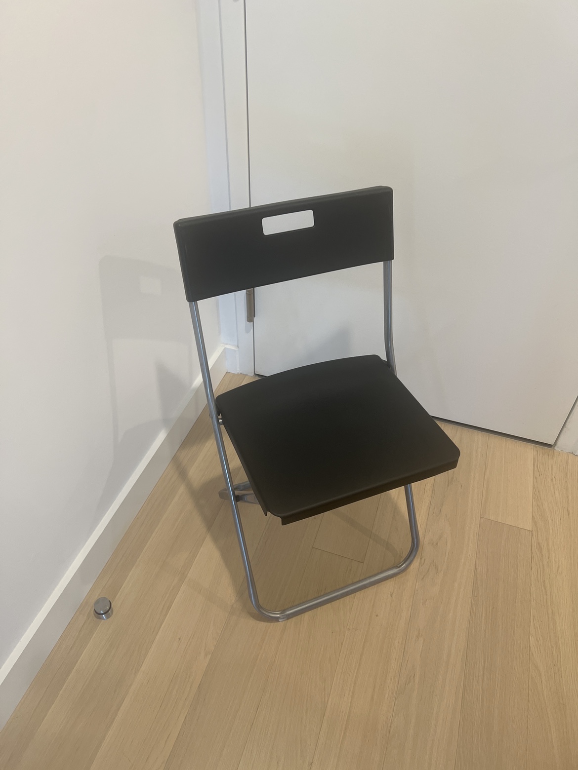3 black plastic simple chairs