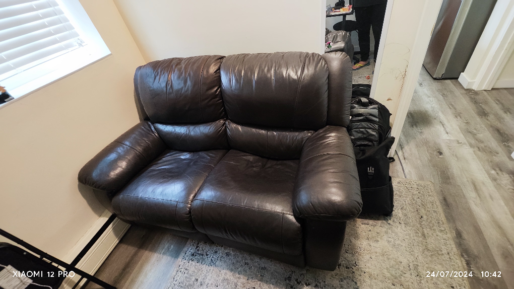 Dark brown faux leather extendible loveseat