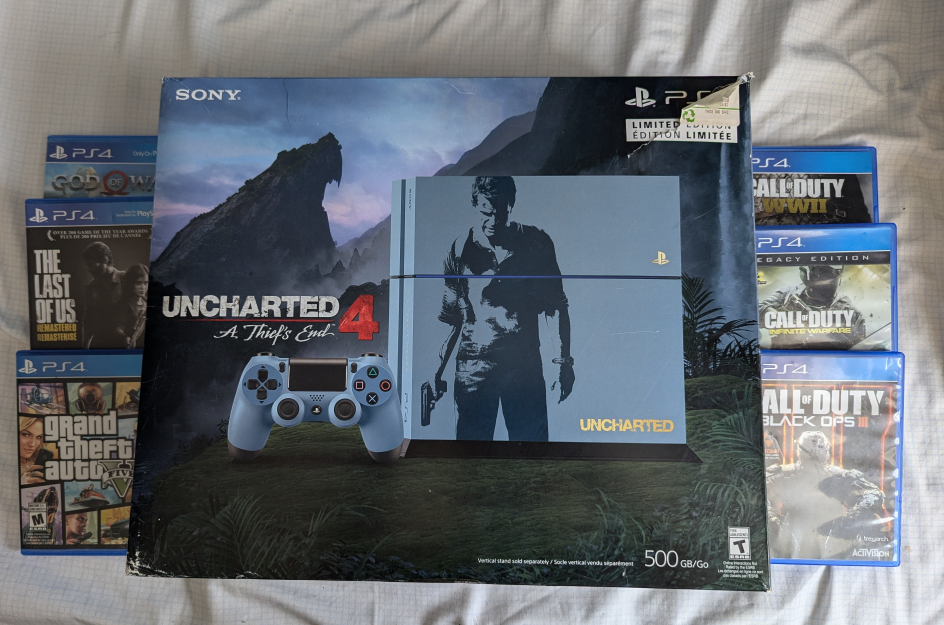 PS4 + 2 Controllers + Games
