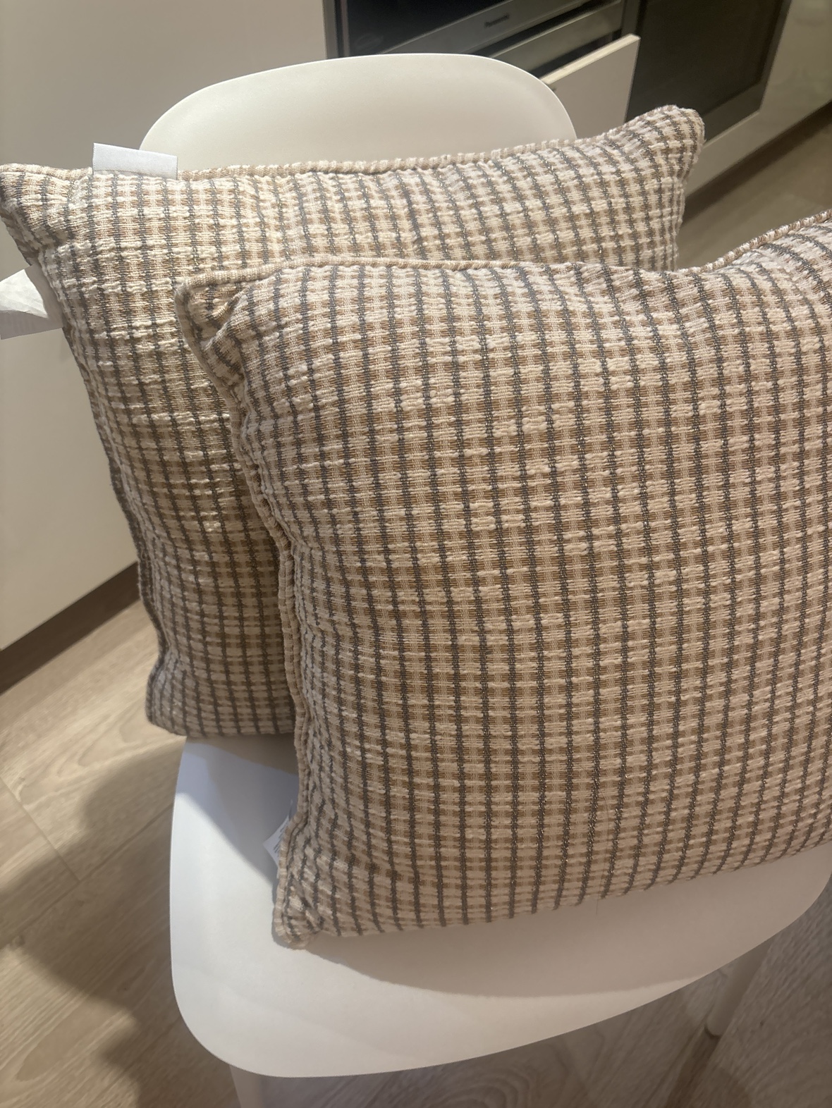 Two Tan & Grey Throw Pillows