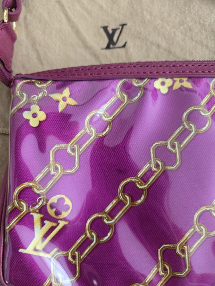 Limited edition fuschia Monogram charms pochette image indicator(7)