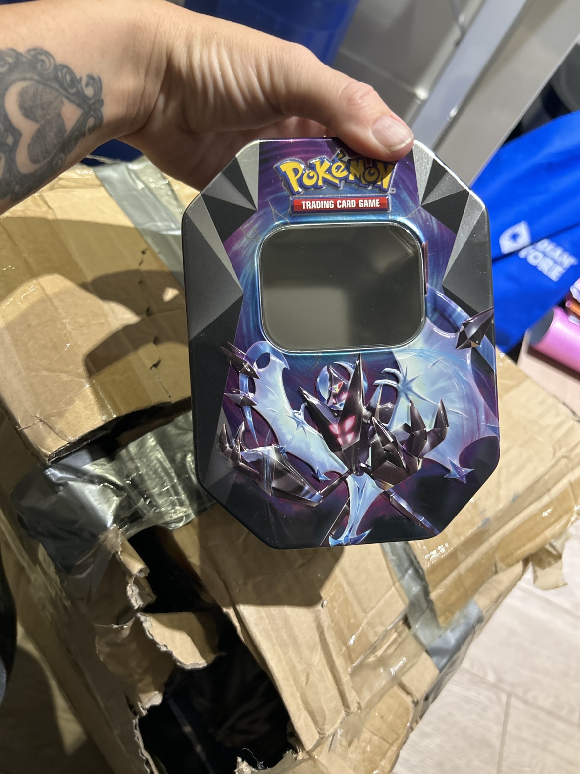 Box full of Empty Pokemon tins