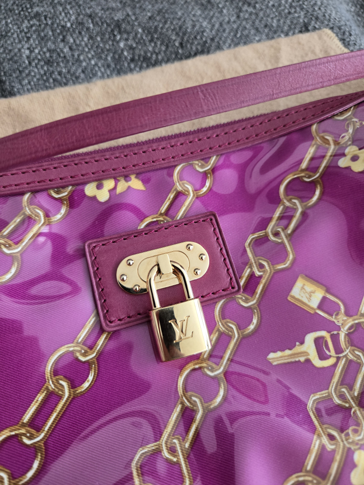 Limited edition fuschia Monogram charms pochette image indicator(5)