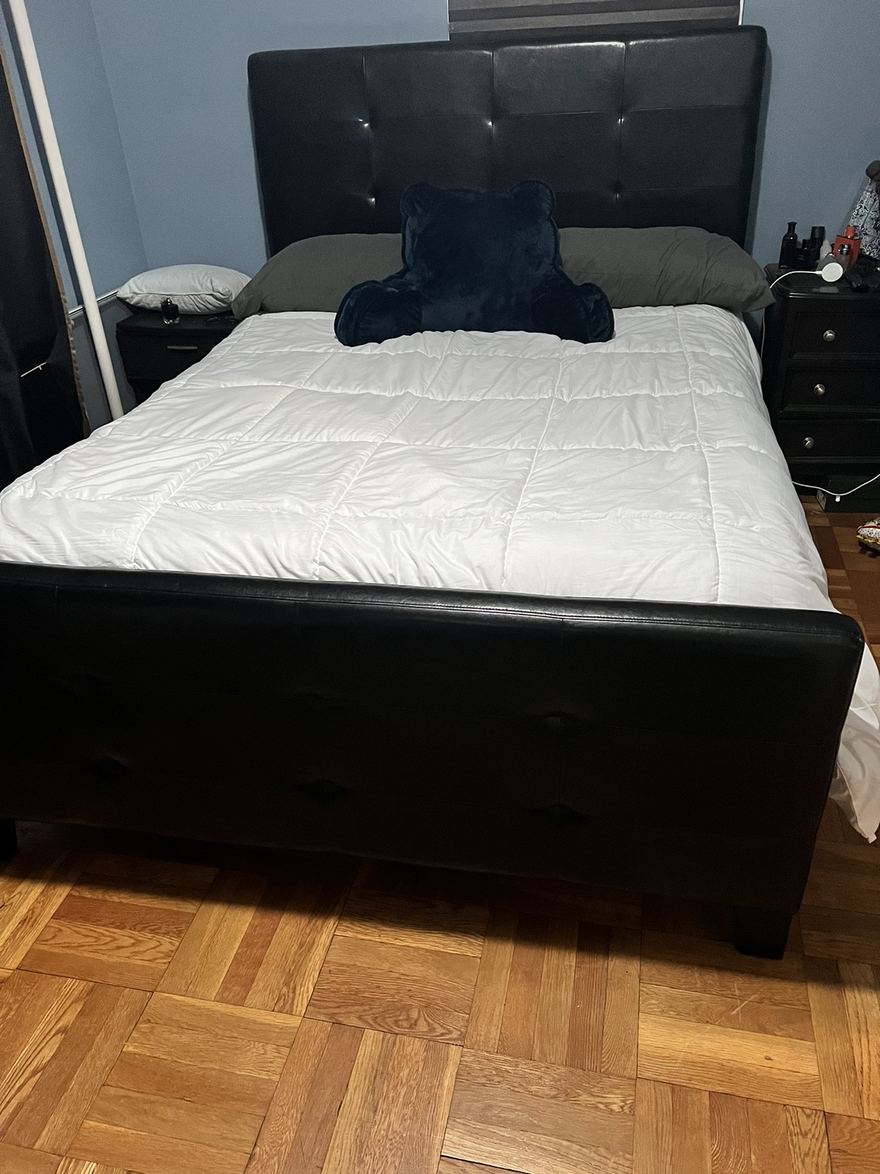 Black Faux Leather Bed Frame with Nightstand and Dresser.