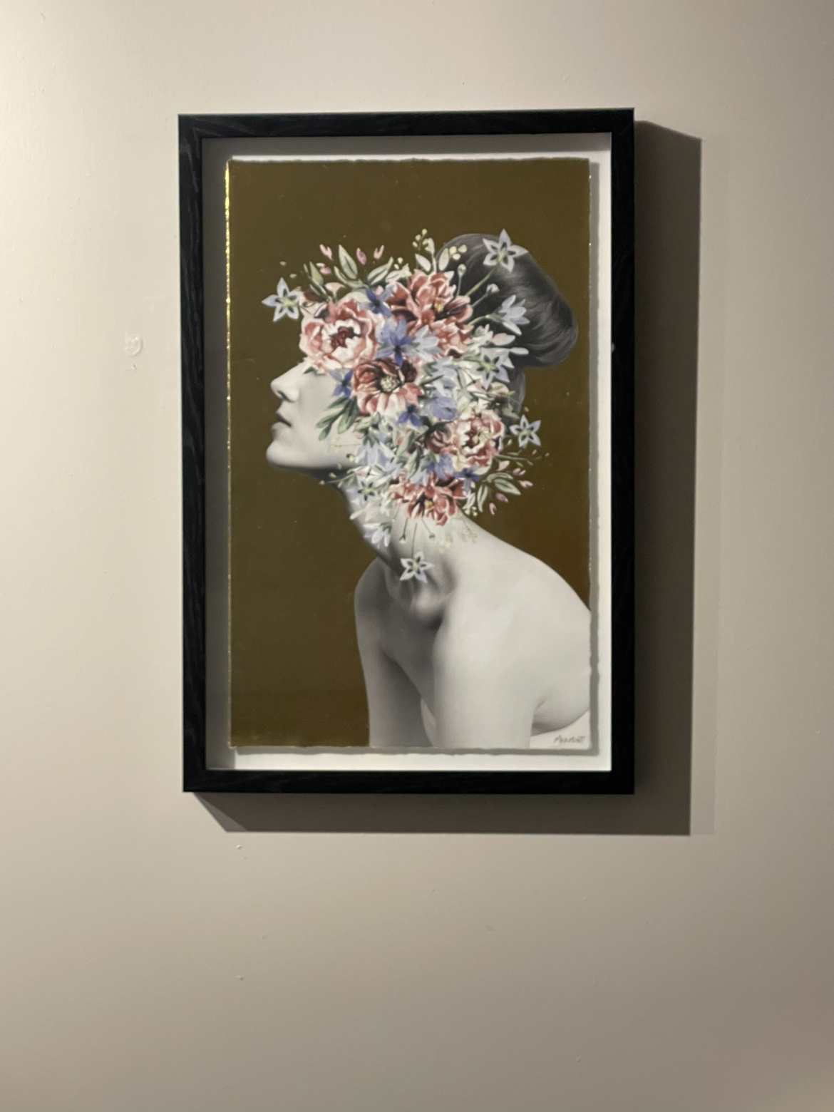 Black framed, metallic art, floral and a woman