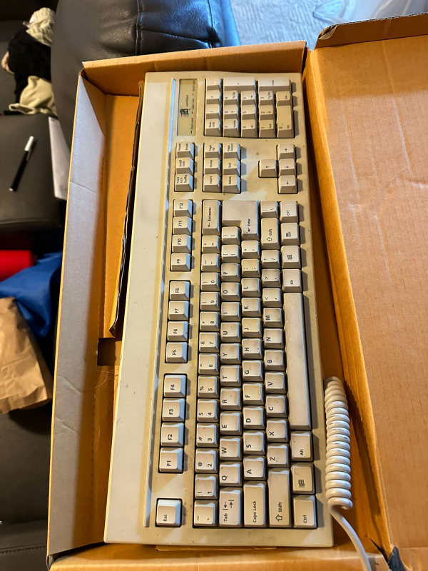 Vintage Keyboard with Coiled Cord thumbnail