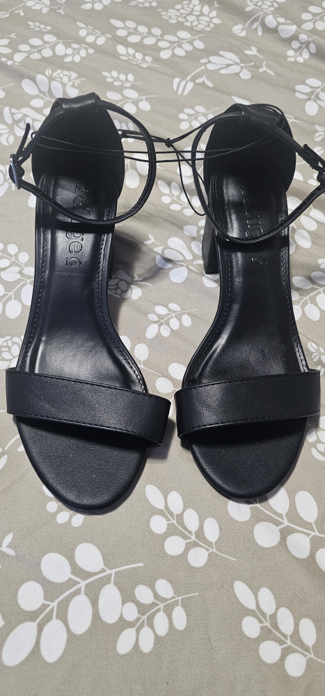 Black heels with ankle strap and buckle closure