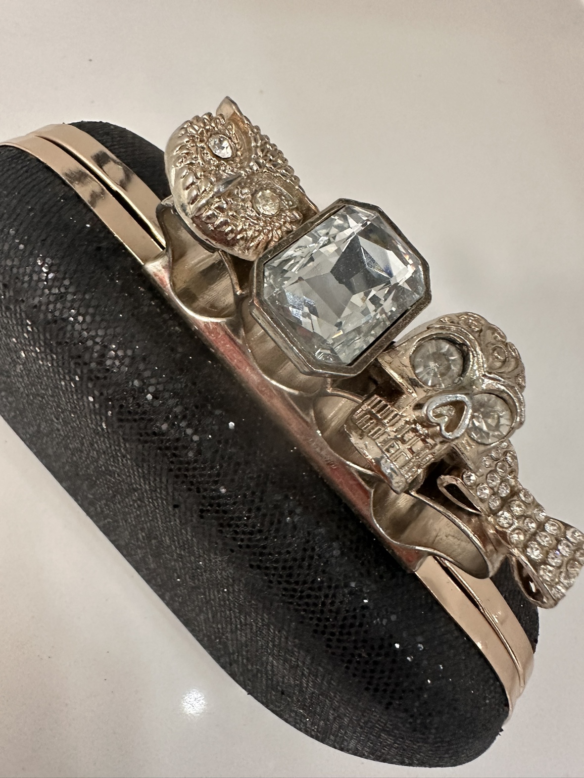 Black Clutch with Gold Ring Handle image indicator(2)