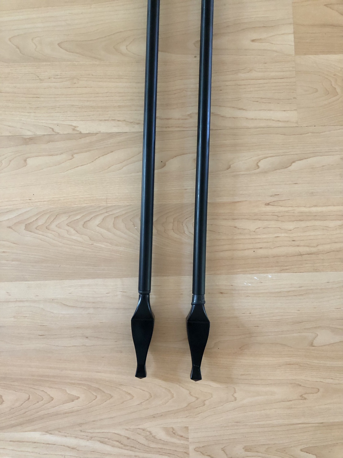 Two adjustable curtain rods with brackets