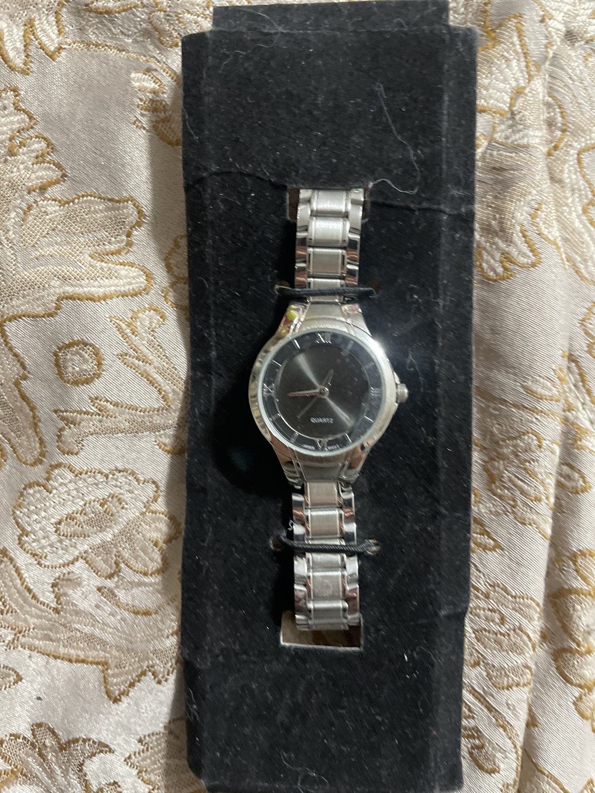 silver quartz watch