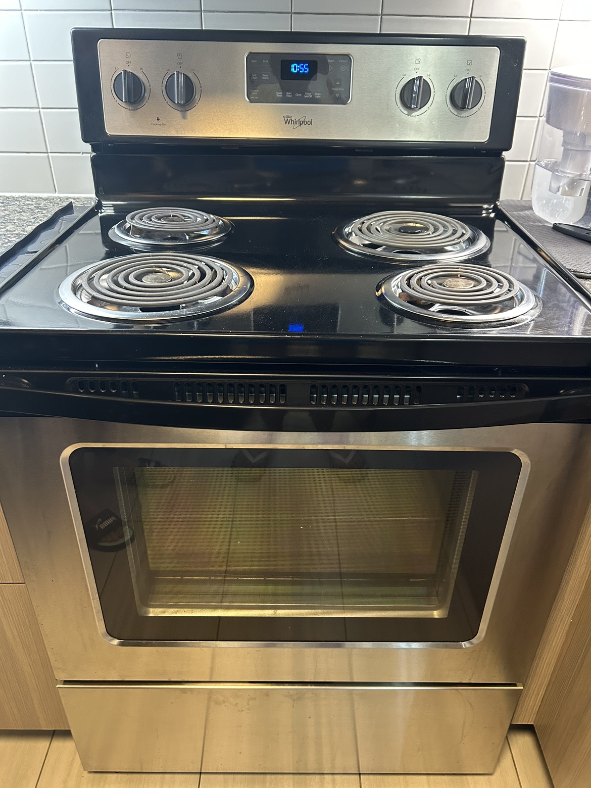 Whirlpool black and silver oven and stove