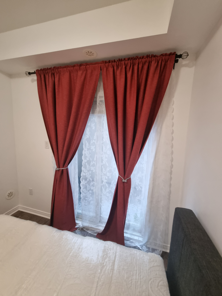 A set of Red Room Darkening Curtains
