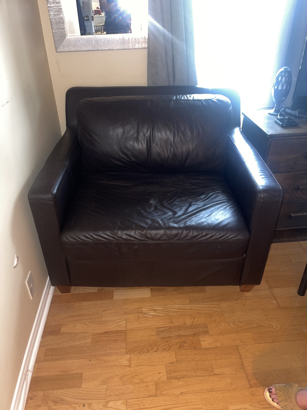 Dark brown, oversized, leather armchair