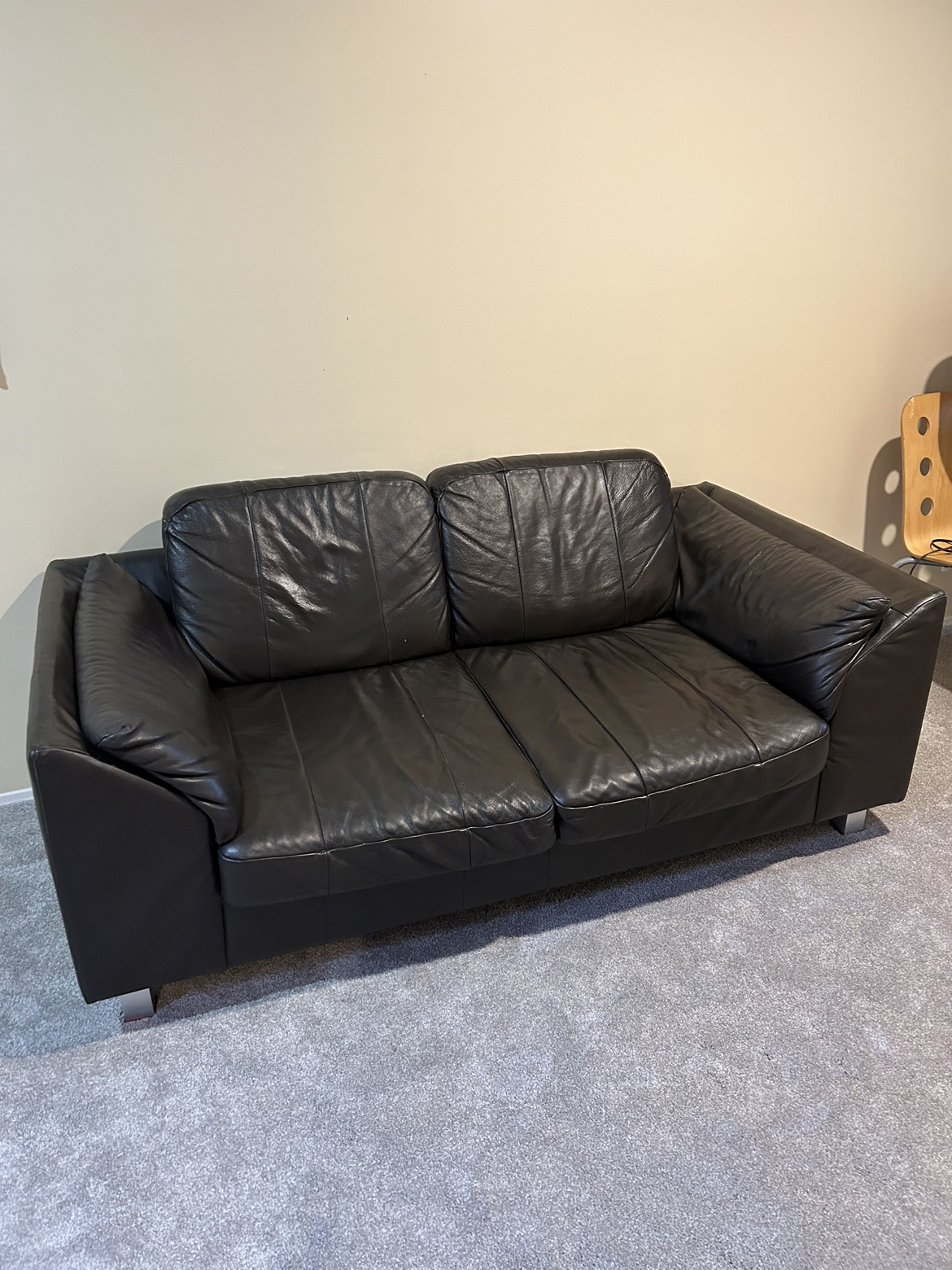Brown leather loveseats